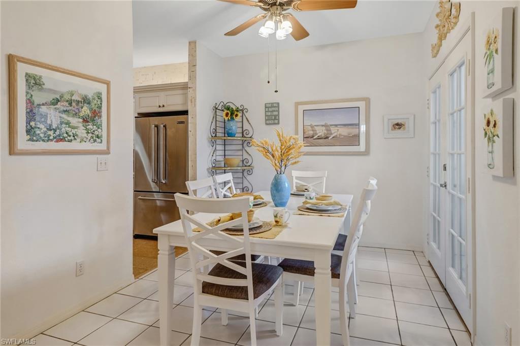 7108 Barrington Circle, Unit 101 Naples, FL 34108 - Photo 6 of 30 a view of a dining room with furniture