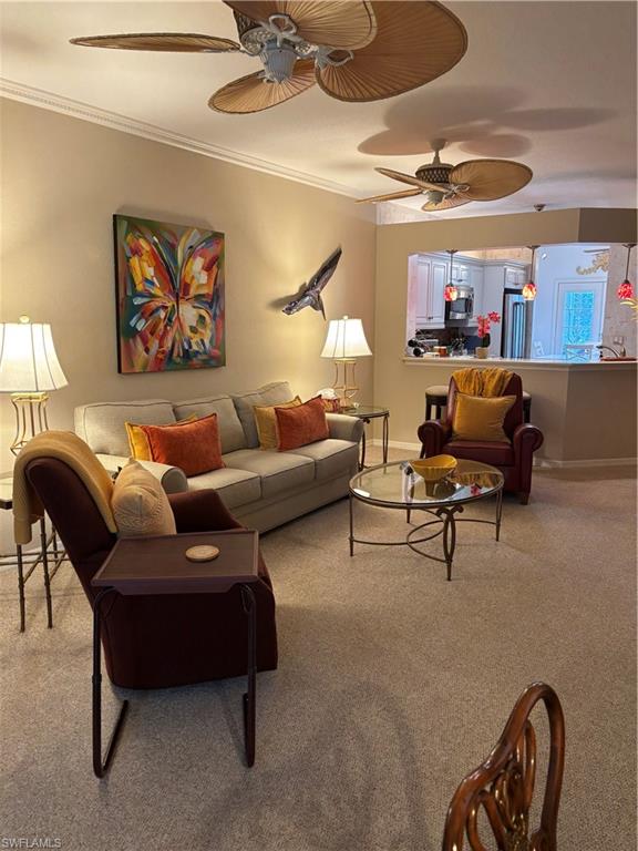7108 Barrington Circle, Unit 101 Naples, FL 34108 - Photo 9 of 30 a living room with furniture and a ceiling fan
