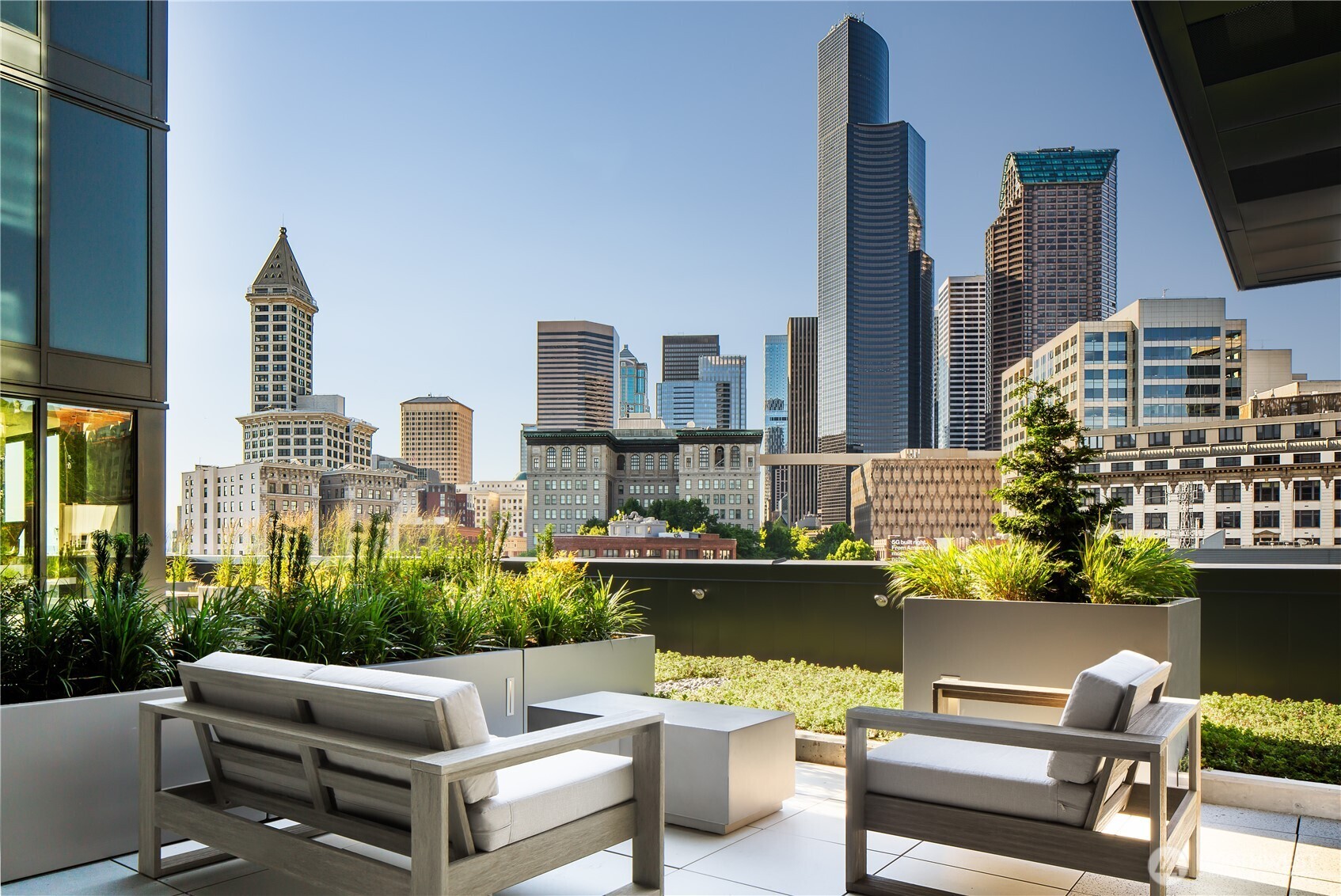 450 South Main Street, Unit 619 Seattle, WA 98104 - Photo 14 of 24 a view of a terrace with couches and potted plants
