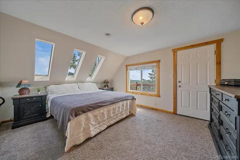 a bedroom with a bed and dresser