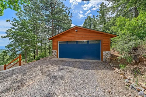 a view of a house in a forest