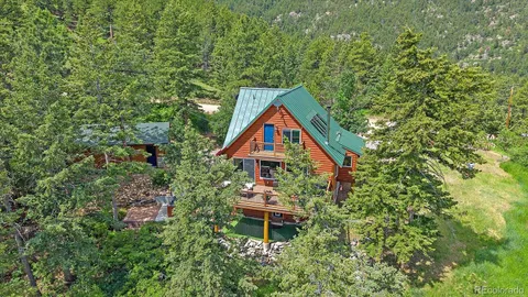 a backyard of a house with seating space