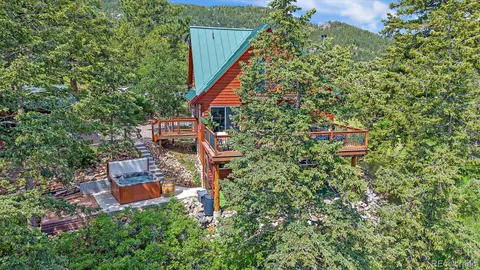 a view of a big yard with lots of green space