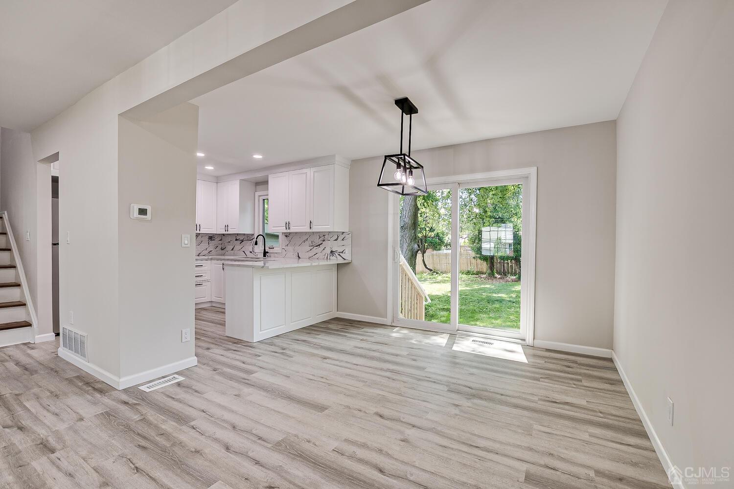 8 Amman Road Edison, NJ 08817 - Photo 20 of 39 a view of large kitchen with wooden floor and window