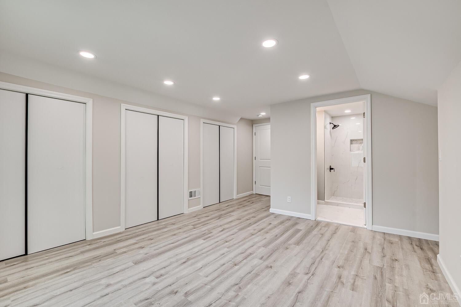 8 Amman Road Edison, NJ 08817 - Photo 28 of 39 a view of an empty room with wooden floor