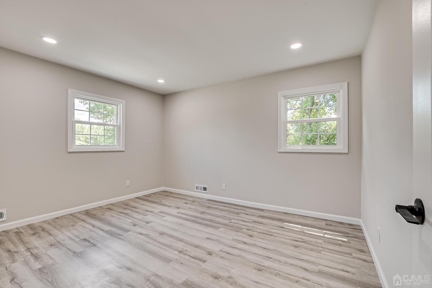 8 Amman Road Edison, NJ 08817 - Photo 30 of 39 a view of room with window and wooden floor