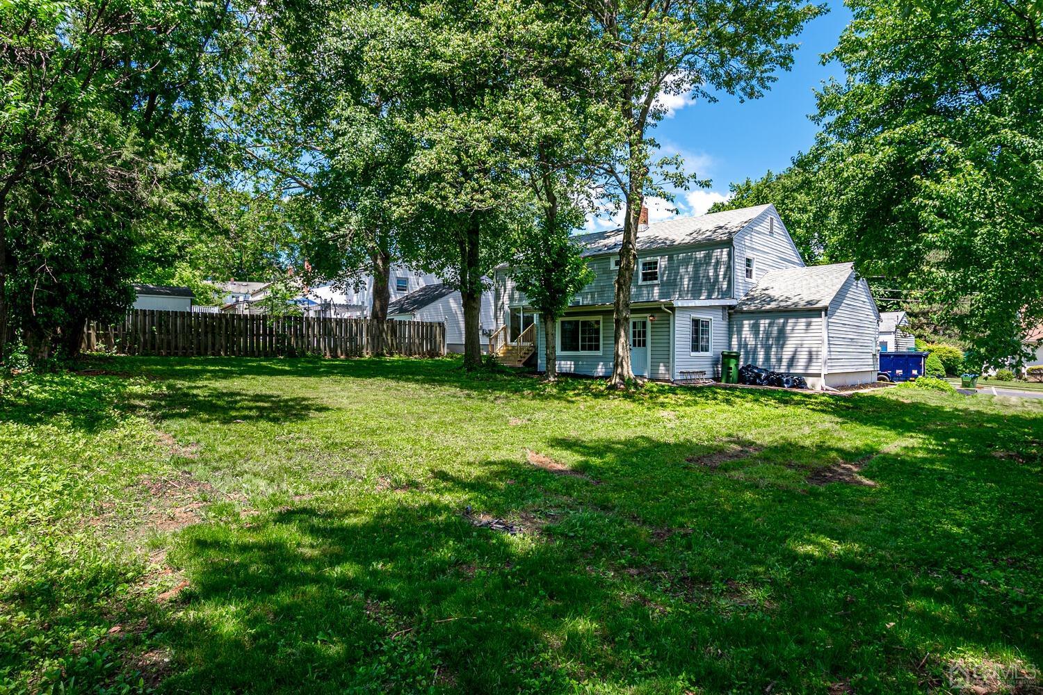 8 Amman Road Edison, NJ 08817 - Photo 38 of 39 a view of a house with a big yard and large trees