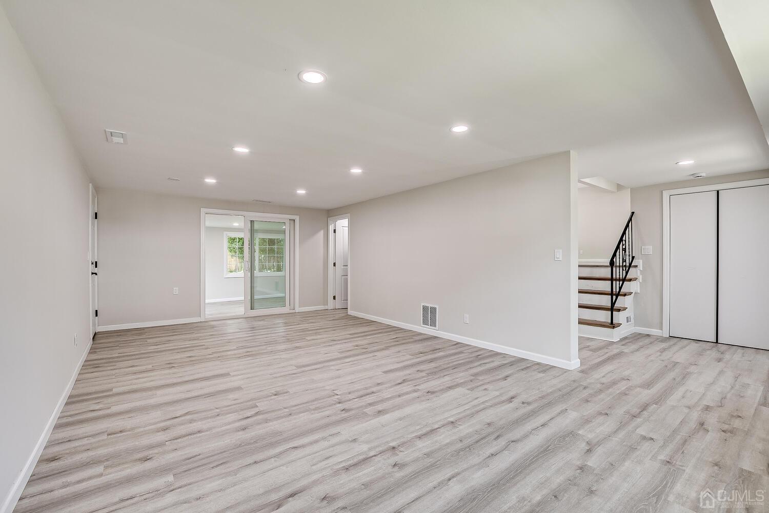 8 Amman Road Edison, NJ 08817 - Photo 9 of 39 a view of empty room with wooden floor