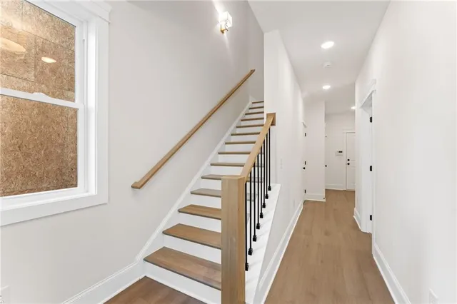 a view of a hallway with stairs