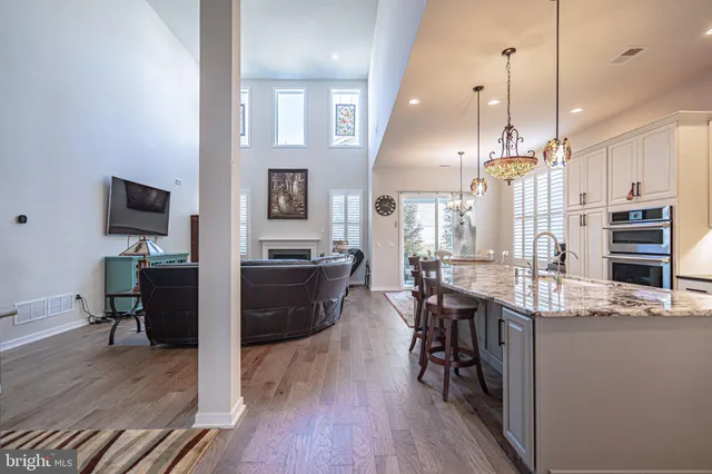 a kitchen with stainless steel appliances granite countertop a stove and a sink