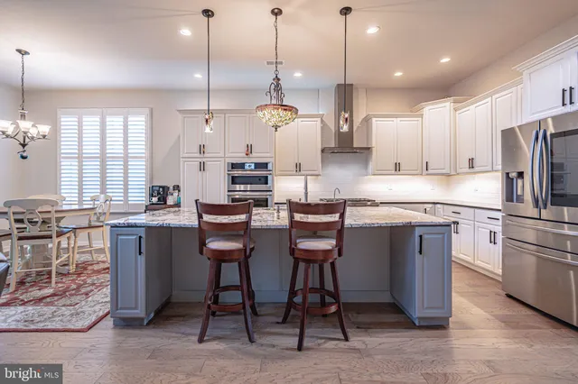 a dining room kitchen with a table and chairs in it