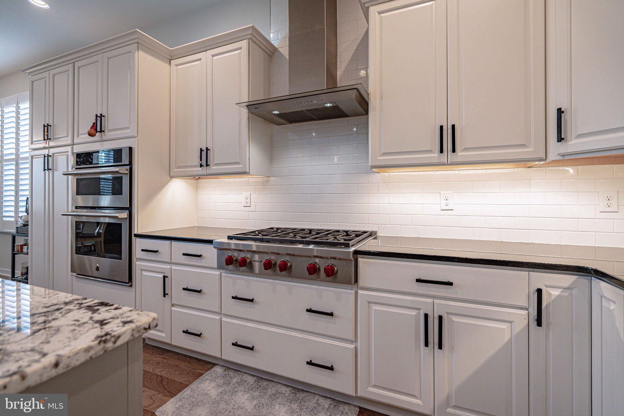 4027 Shef's Way Allentown, PA 18104 - Photo 20 of 80 a kitchen with stainless steel appliances granite countertop a stove and a refrigerator