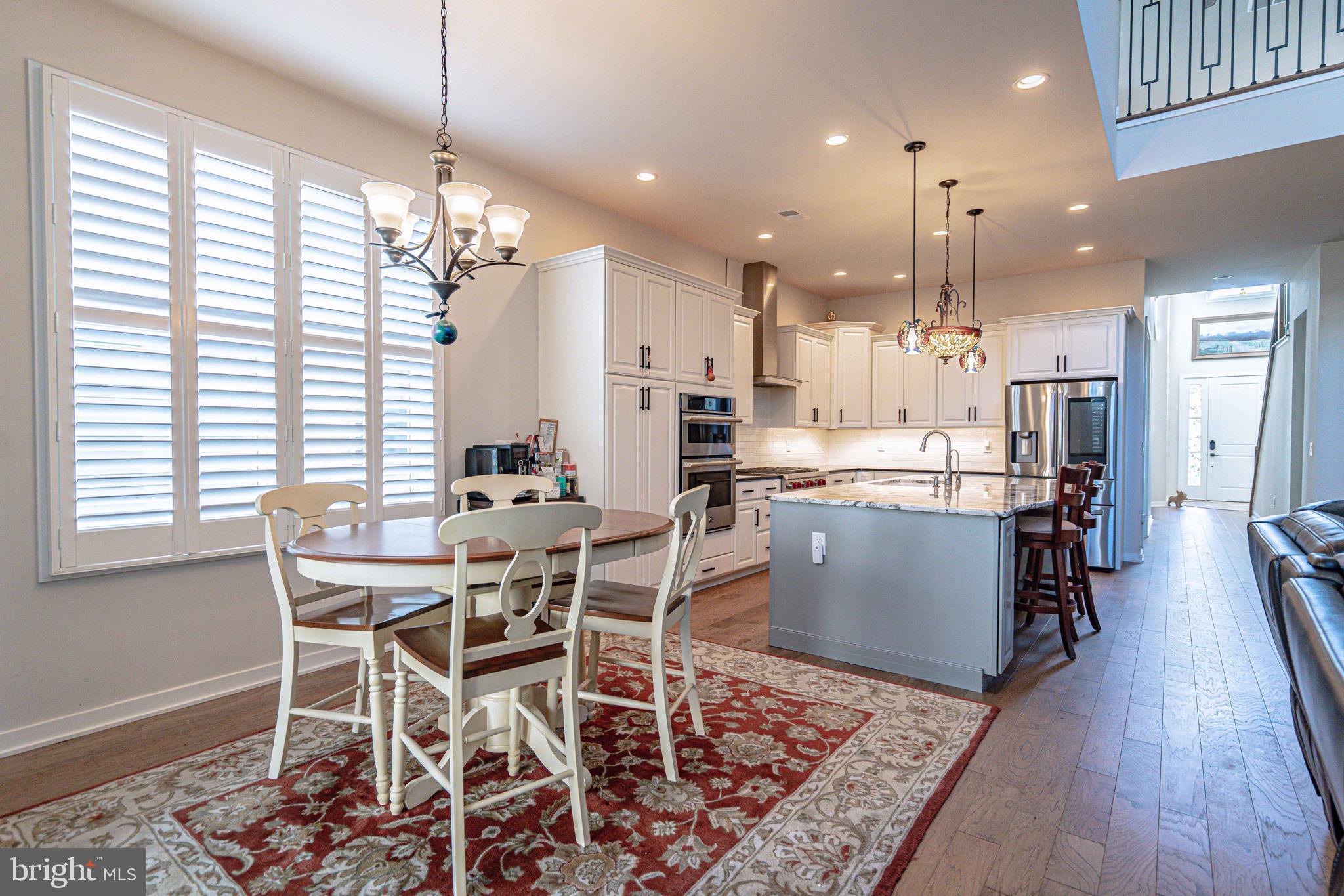 4027 Shef's Way Allentown, PA 18104 - Photo 27 of 80 a dining room kitchen with a table and chairs in it
