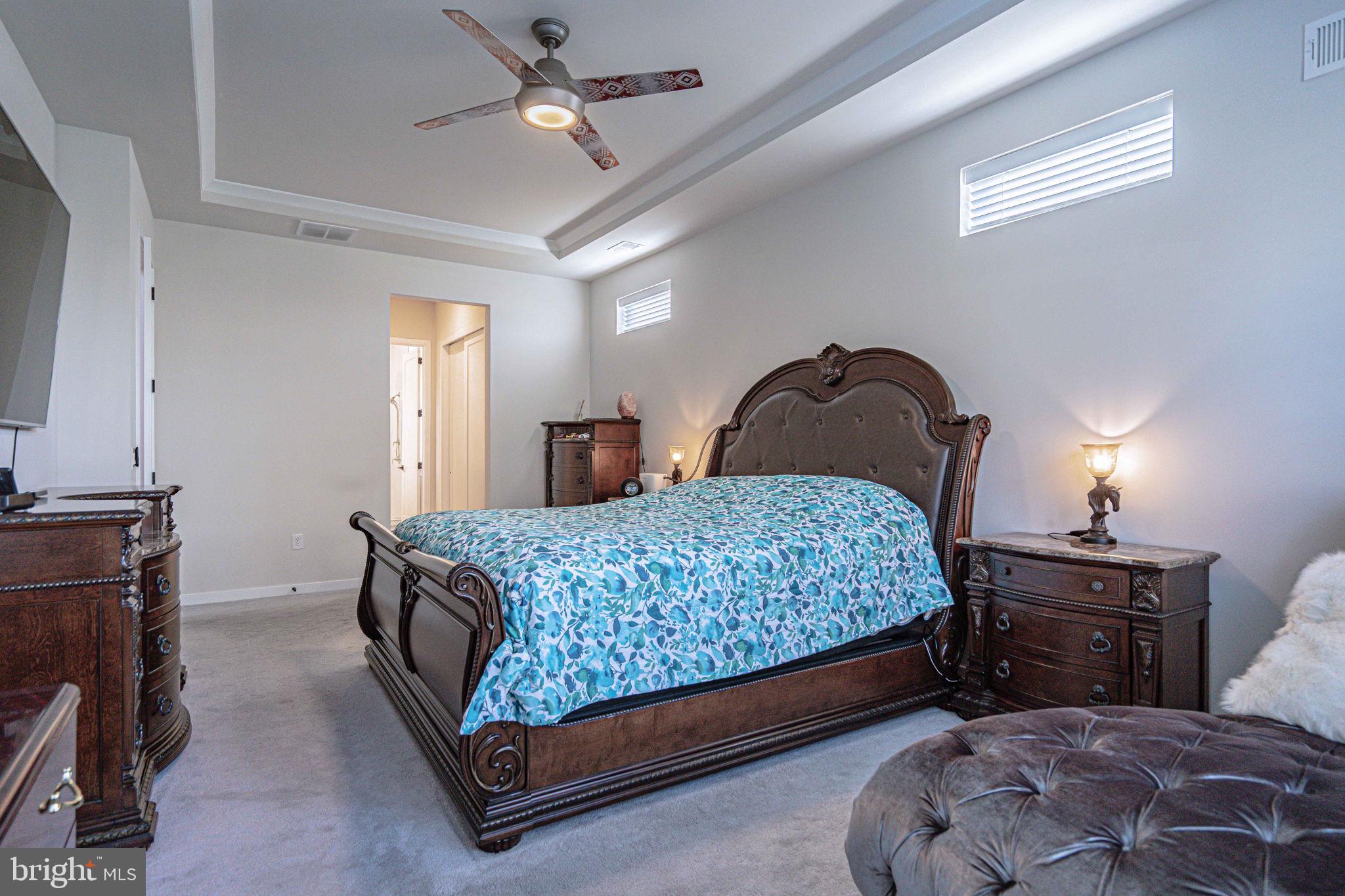 4027 Shef's Way Allentown, PA 18104 - Photo 32 of 80 a bedroom with a bed and a chandelier