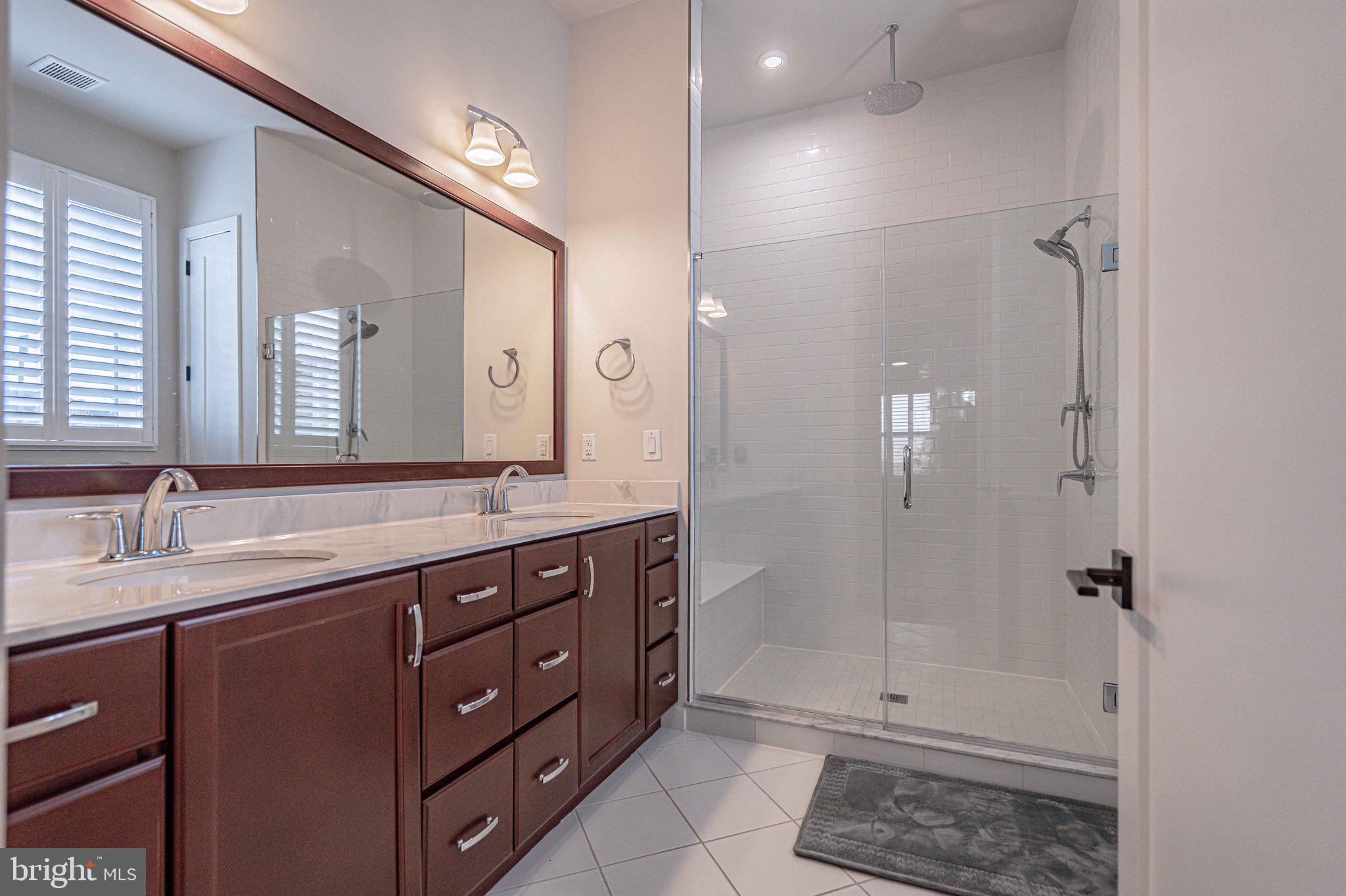 4027 Shef's Way Allentown, PA 18104 - Photo 34 of 80 a bathroom with a sink a toilet and shower