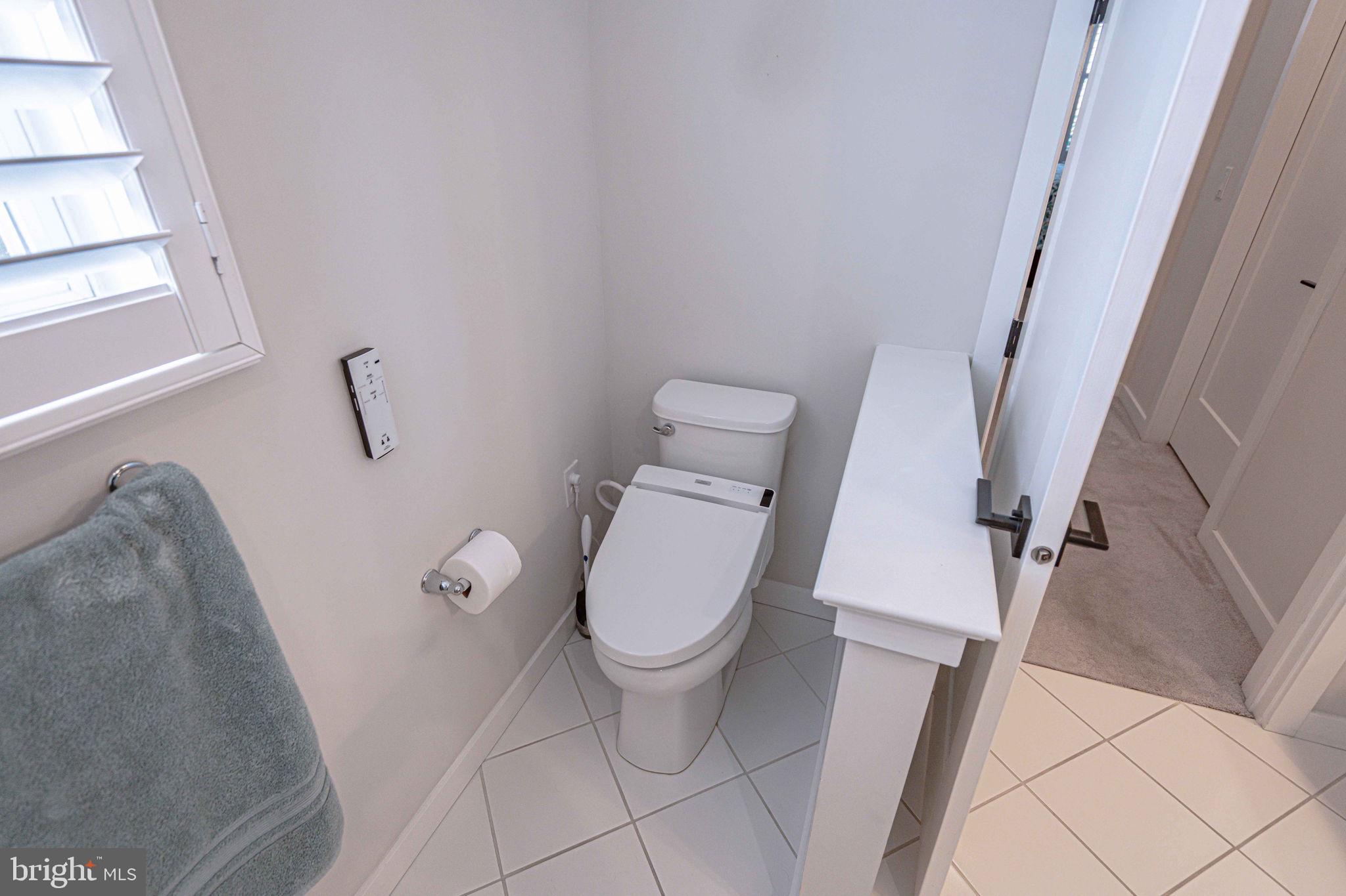 4027 Shef's Way Allentown, PA 18104 - Photo 36 of 80 a white toilet sitting next to a small tub