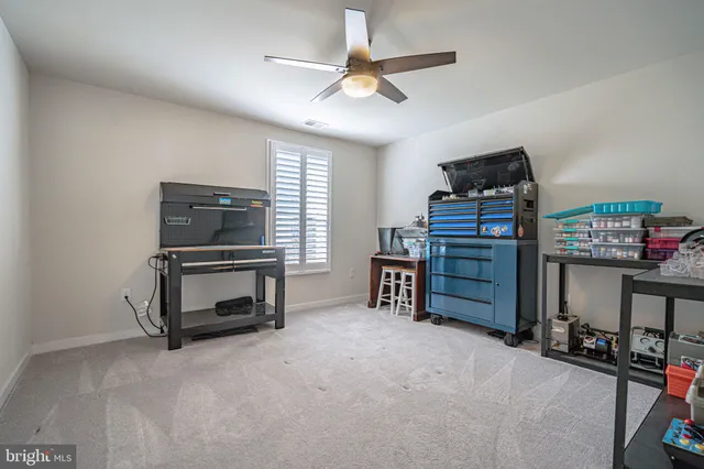 a table and chairs in a room next to a window