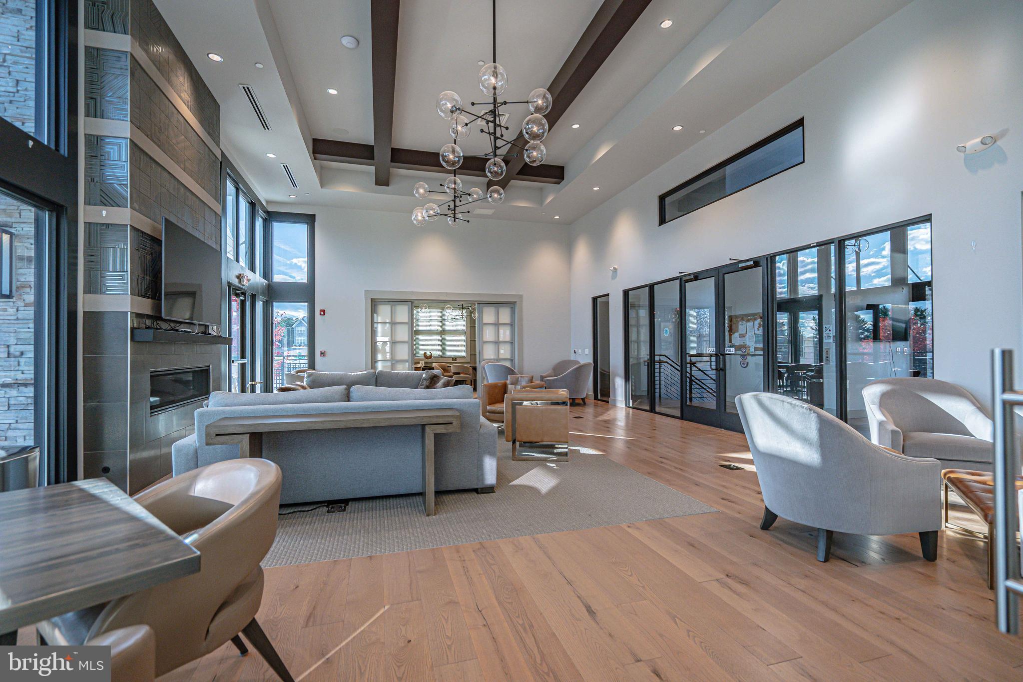 4027 Shef's Way Allentown, PA 18104 - Photo 68 of 80 a living room with fireplace furniture and a chandelier