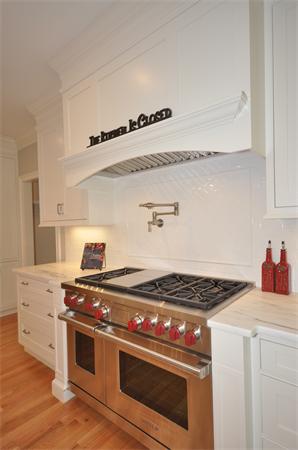 36 Somerset Road Lexington, MA 02420 - Photo 11 of 22 a stove top oven sitting inside of a kitchen