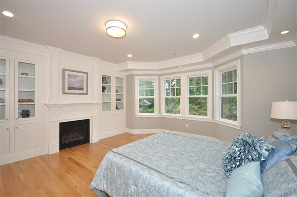 36 Somerset Road Lexington, MA 02420 - Photo 13 of 22 a bedroom with a bed and a fireplace
