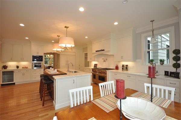 36 Somerset Road Lexington, MA 02420 - Photo 9 of 22 a kitchen with stainless steel appliances kitchen island granite countertop a sink and cabinets