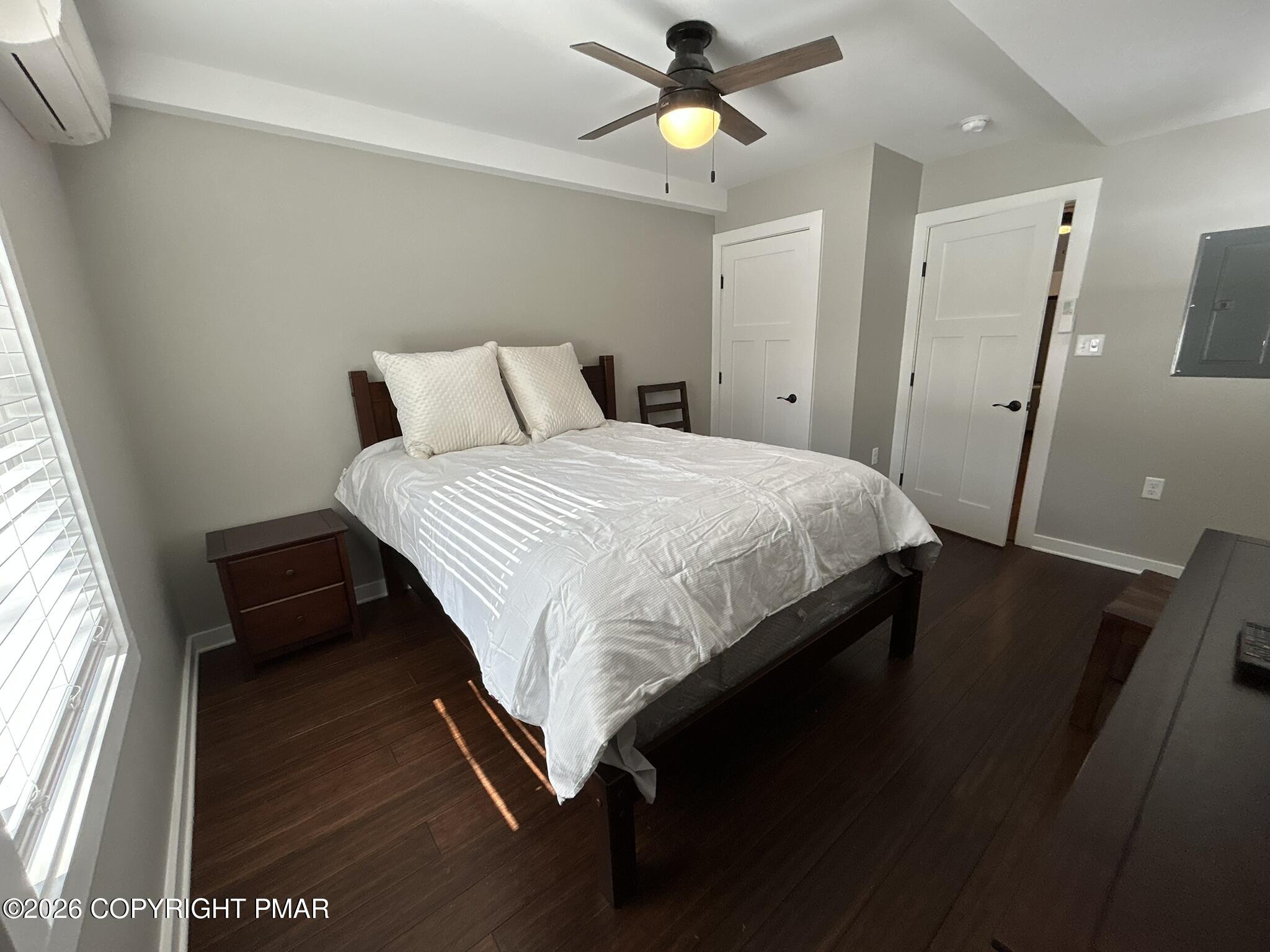 2 Rockridge Road Lake Harmony, PA 18624 - Photo 12 of 19 a bedroom with a bed and wooden floor