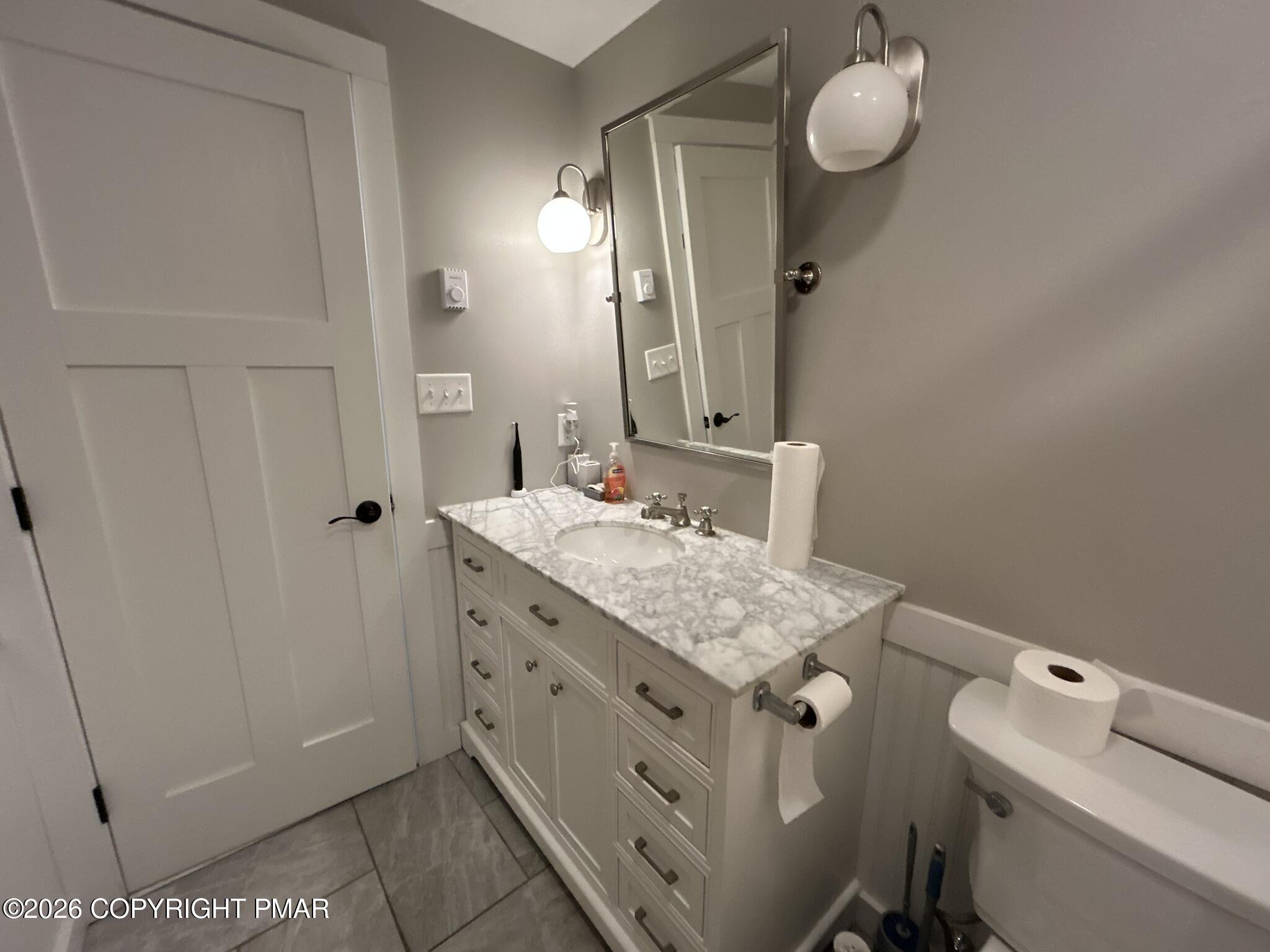 2 Rockridge Road Lake Harmony, PA 18624 - Photo 15 of 19 a bathroom with a granite countertop sink and a mirror