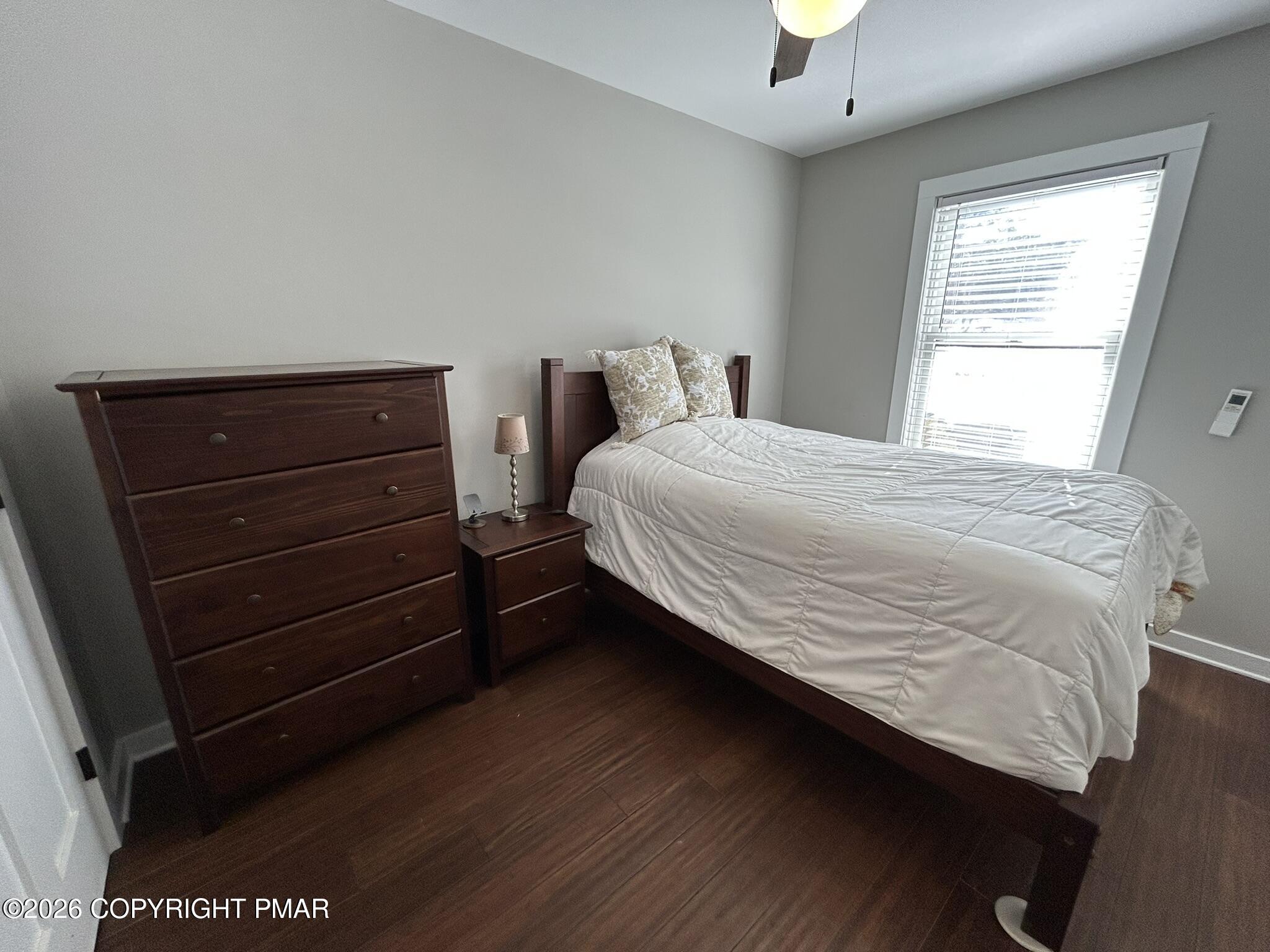 2 Rockridge Road Lake Harmony, PA 18624 - Photo 17 of 19 a bedroom with a bed and a lamp on dresser