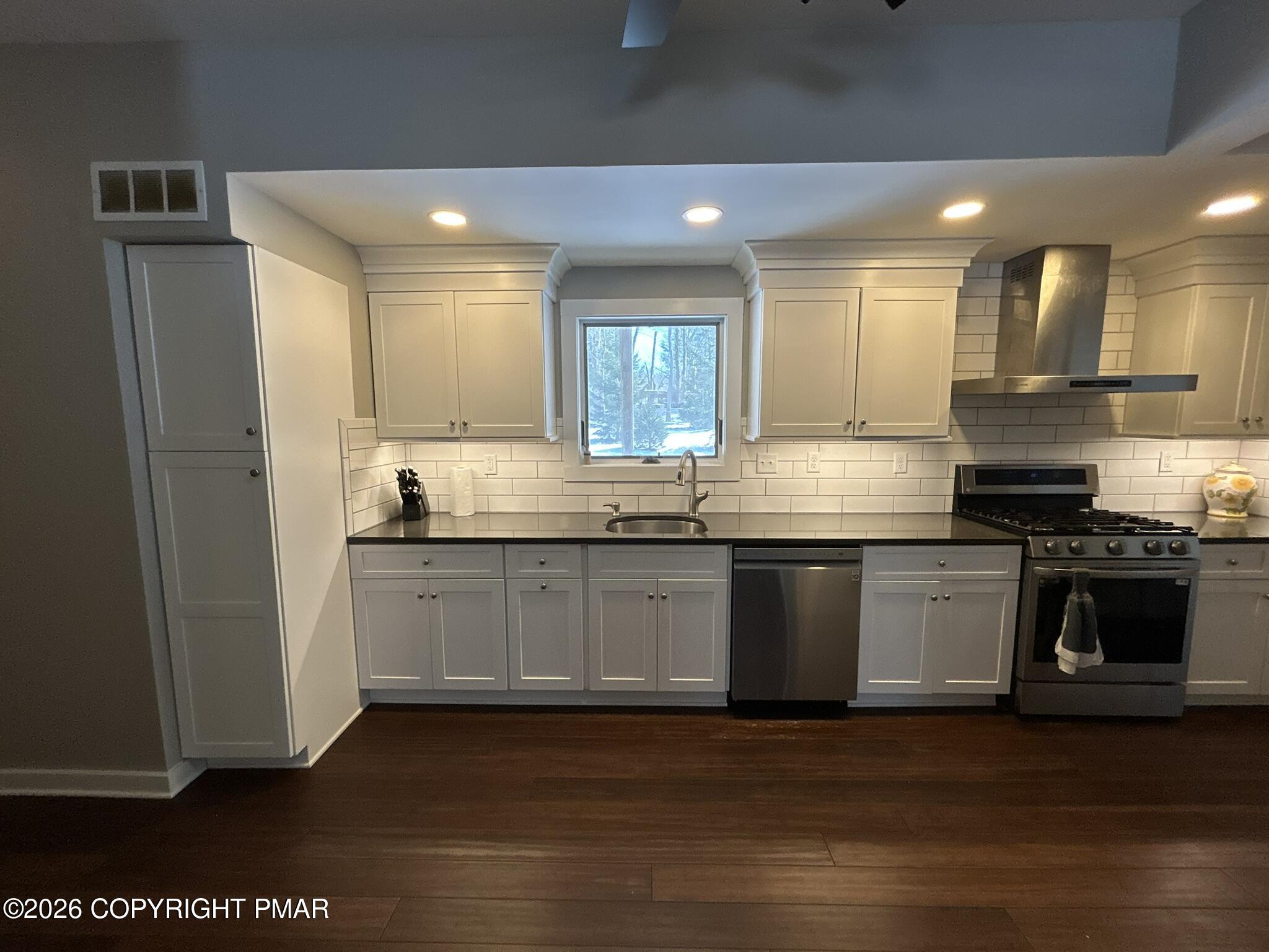2 Rockridge Road Lake Harmony, PA 18624 - Photo 2 of 19 a kitchen with stainless steel appliances granite countertop a stove a sink and a refrigerator