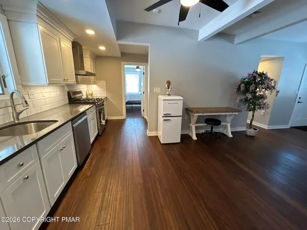 a kitchen with sink and cabinets