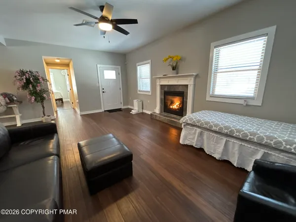 a living room with a fireplace and a fireplace