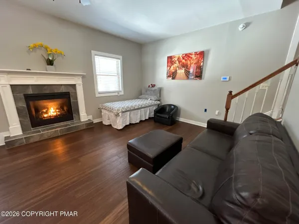 a living room with furniture and a fireplace
