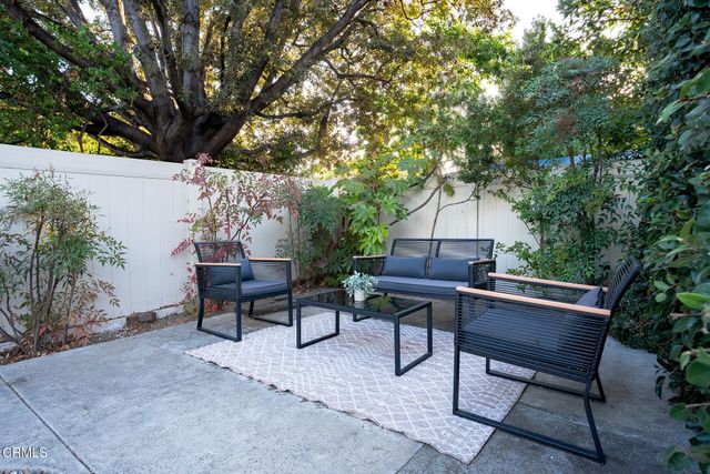 a view of house with swimming pool outdoor seating