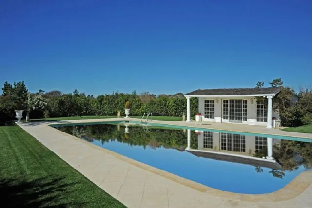 a view of a lake with a house in the background