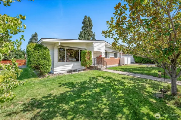 front view of a house with a yard