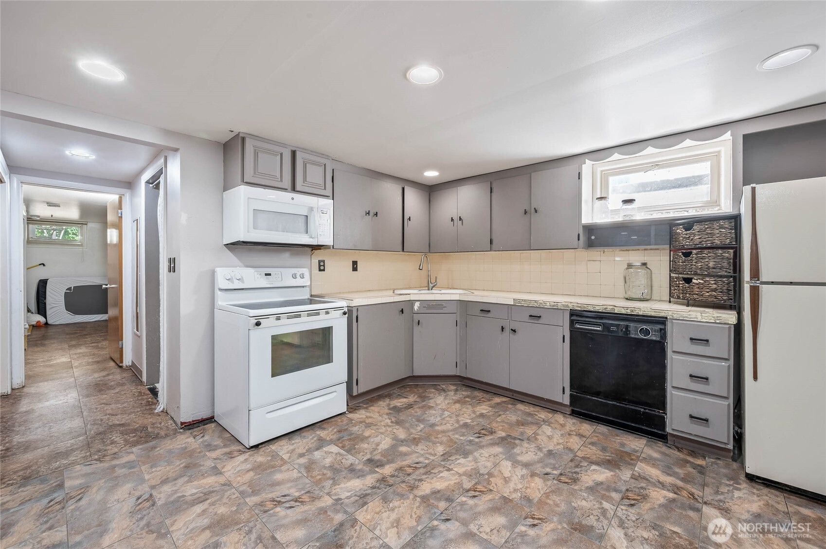 33 North Furney Street Wenatchee, WA 98801 - Photo 17 of 22 a kitchen with stainless steel appliances and white cabinets