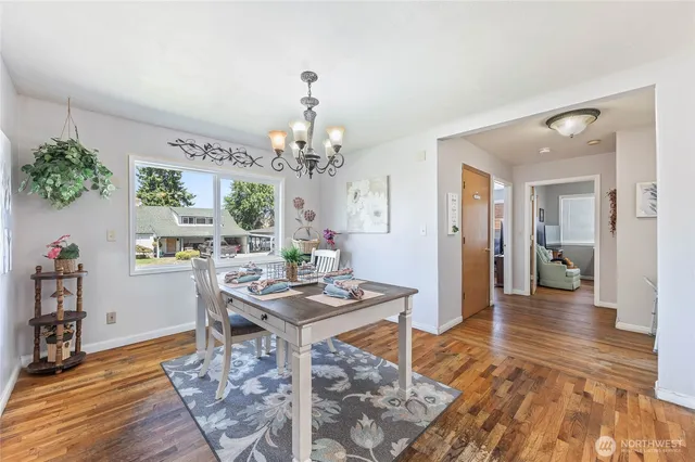 a very nice looking dining room with a table and chairs