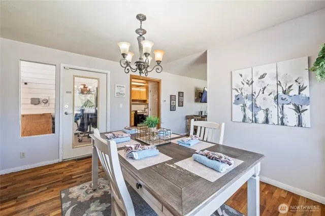 a view of a dining room with furniture window and wooden floor