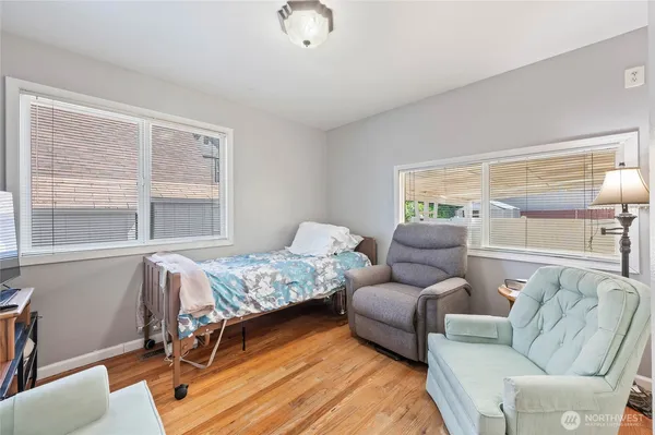 a bedroom with furniture and a window