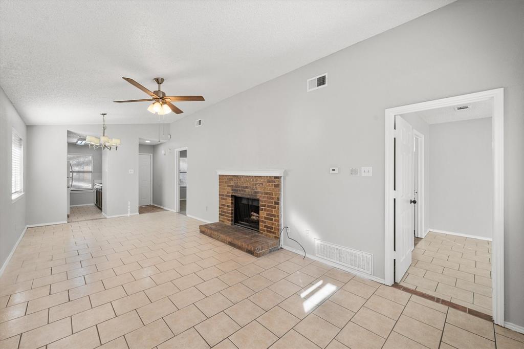 5821 Mansfield Road Arlington, TX 76017 - Photo 13 of 24 a view of a livingroom with a fireplace
