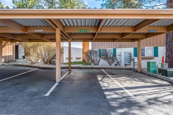 a view of a patio with table and chairs