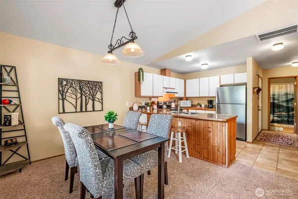 a view of a dining room with furniture