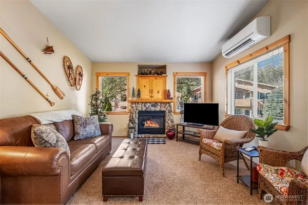 a living room with furniture flat screen tv and a fireplace