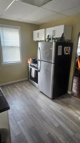 a view of kitchen and wooden floor