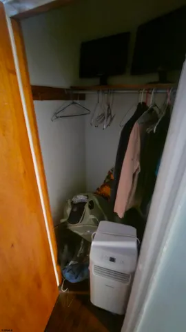 a dining room with furniture window and wooden floor