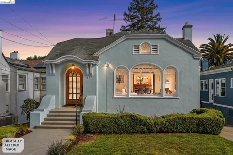 a living room with furniture fireplace and a large window