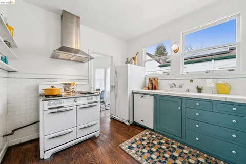 a bedroom with a bed mirror and window