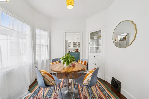 a bedroom with a bed and a dresser with mirror