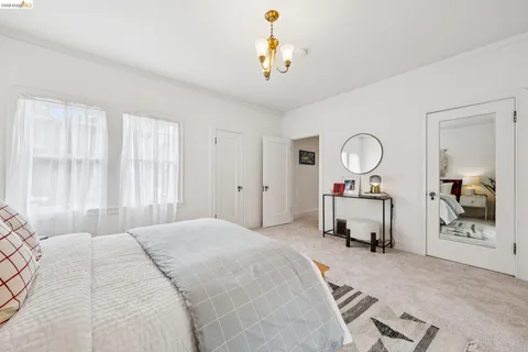 a view of a patio with table and chairs with wooden floor and fence