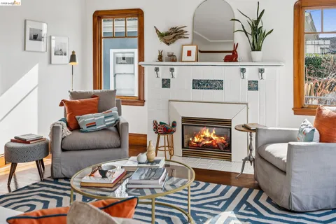 a kitchen with a stove cabinets and wooden floor